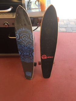 Pair of Quest longboard skateboards