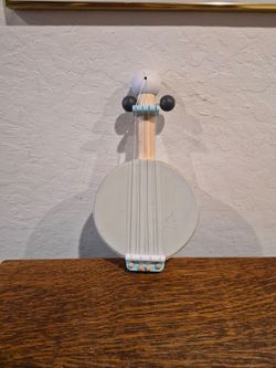 Plan Toys x PBK Kids Banjo in a cream and blue-gray colorway.