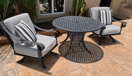6 Large metal  patio chairs , to our loungers, two Ottomans and four rocking chairs