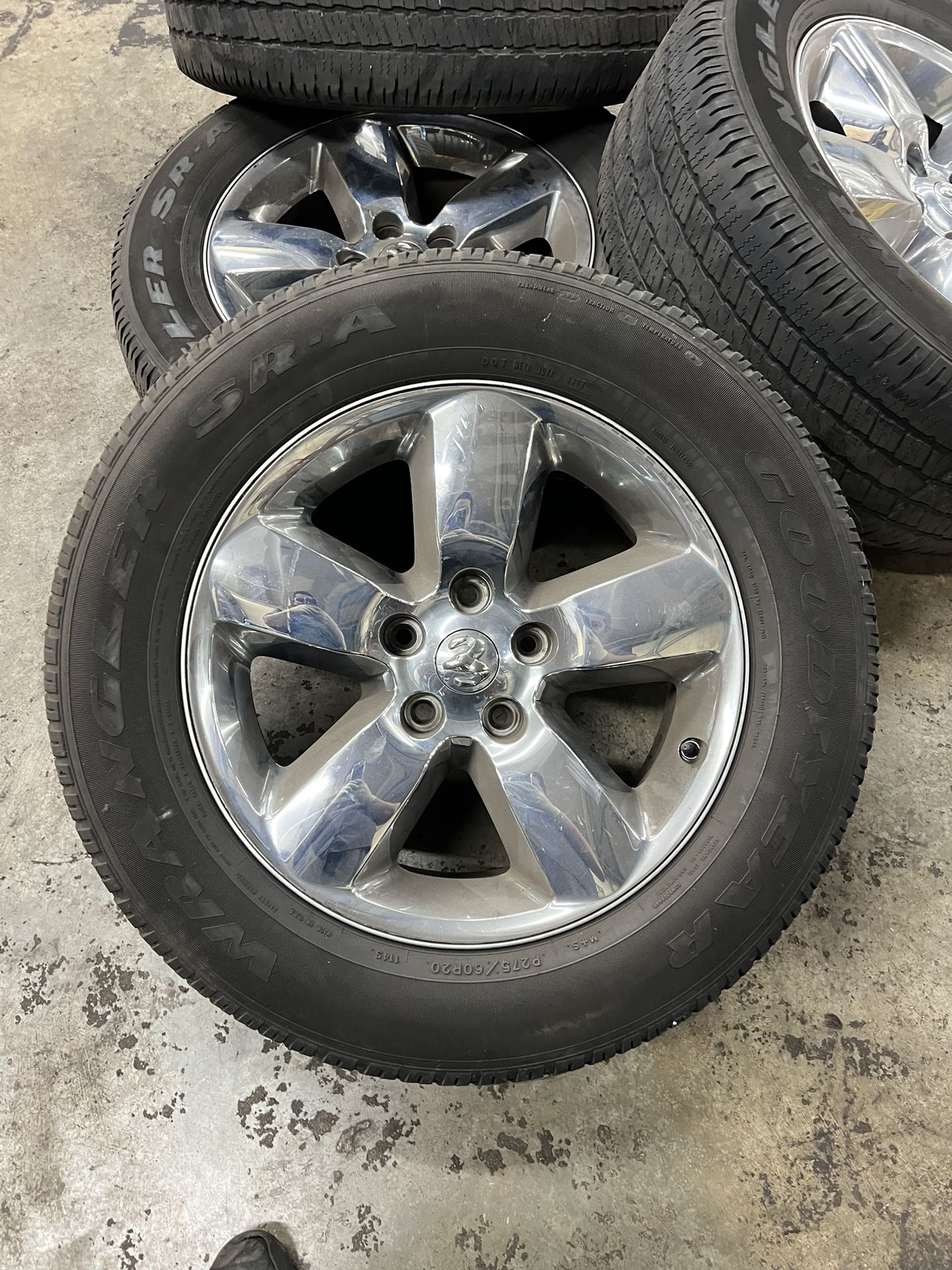 Set of 4 OEM Dodge Chrome Alloy Wheels with Goodyear Wrangler SR-A Tires. Used