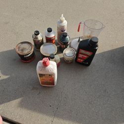 Random Assortment Of Oil Brake Fluid And Grease Also Lighter Fluid
