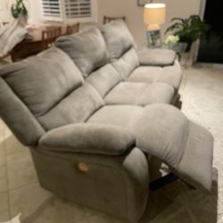 Sofa with recliners on both sides