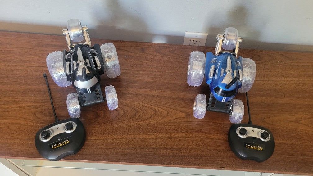 TWO SHARPER IMAGE RC 360 RALLY CAR