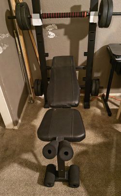 Weight Bench with Barbell and Plates