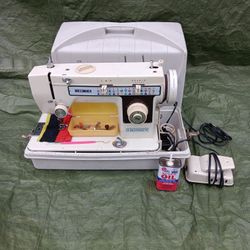 Singer 2402 Sewing Machine With Yards Of Clothing Materials