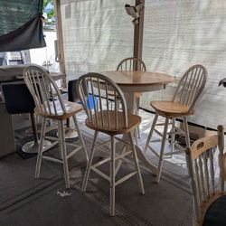 Two Wood Tables One Tall One And A Small One.