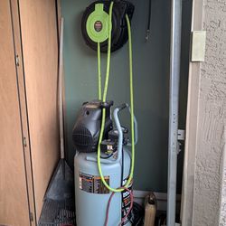 Air compressor. Retractable wall mounted hose reel included