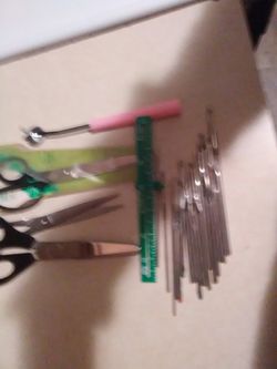 20 crochet hooks and three pair scissors n ruler