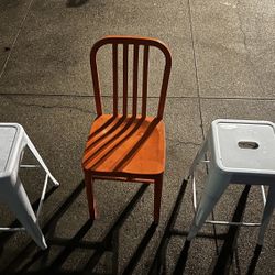 Orange Chair & White Stools 