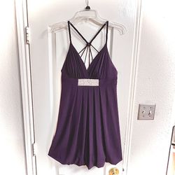 Woman’s deep purple sleeveless halter mini dress with bling embellishments 
