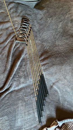 TaylorMade Burner iron set with a TaylorMade Rossa Nubbins putter.