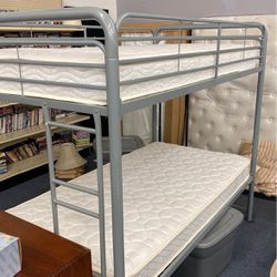 Twin over twin bunk bed in Escalon shape includes mattresses