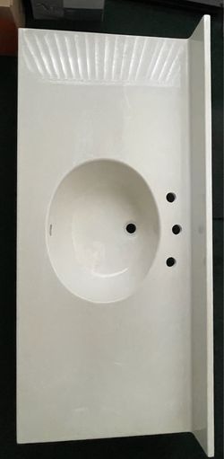 Two Cultured Marble One Piece Sink and Vanity Tops With Matching Widespread Faucets