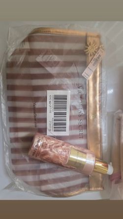 Victoria secret body oil and travel bag
