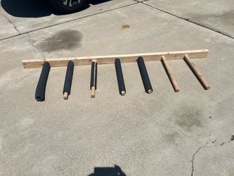 Surfboard wall rack