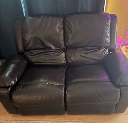 Leather reclining love seat
