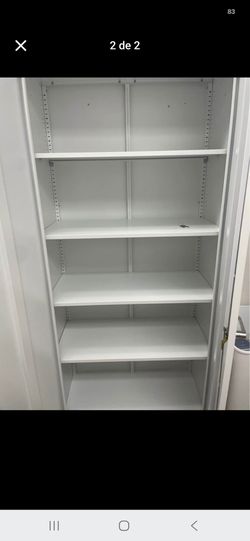 Solid. Metal storage cabinet with key