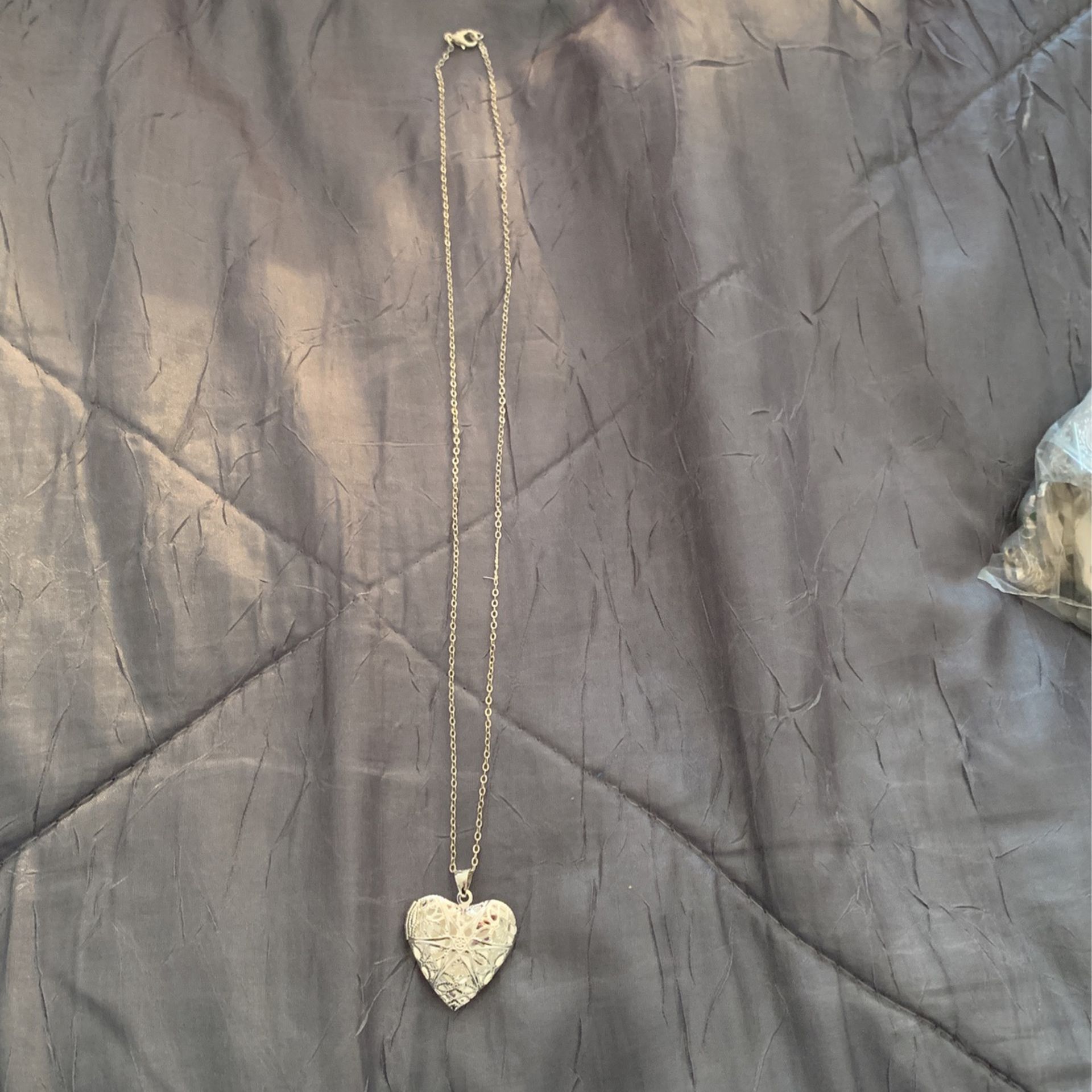 Sterling silver heart locket diamond cut