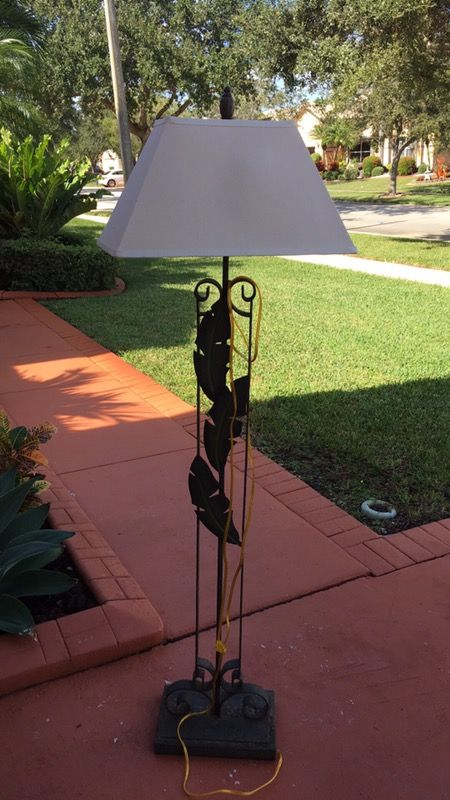 Iron floor lamp, with palm tree design and three way light adjustment. Set of table lamps also available for sale separately at $19.00 each lamp.