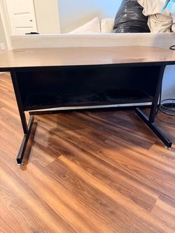 Modern Brown and black wooden desk.