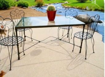Glass table and 4 iron chairs