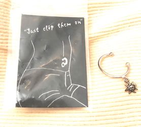 Sterling silver clip on belly with sun charm