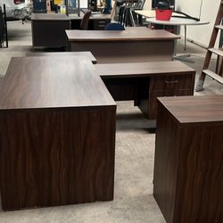 desk, table and cabinets. 