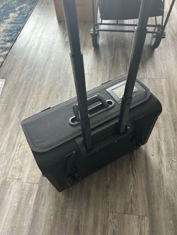 Black canvas roller luggage