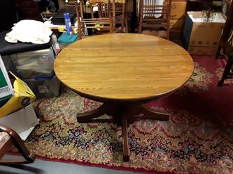 Antiqie Oak table refinished with matching set of 6 cane bottom chairs in excellent condition.