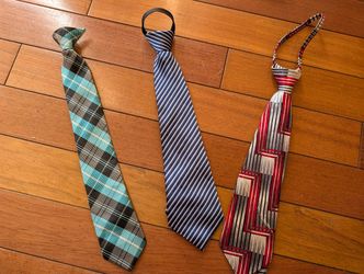 three boy's ties (one clip-on necktie, two zip-up tie)