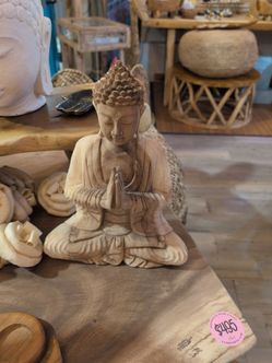 Praying Buddha wooden sculpture