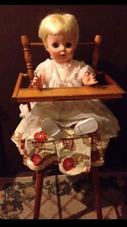 Doll with chair has clothes too