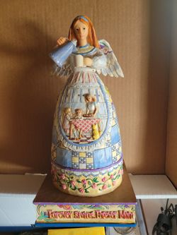 Carved Figurine Giving Mom