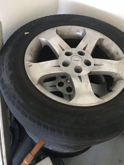 (4) 5 lug Nissan wheels