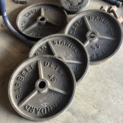 4 Barbell Olympic Weights 45’s 