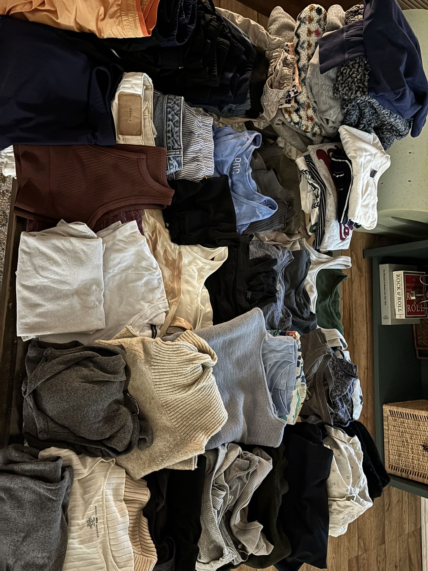 Bundle of 100+ thrifted, new, vintage clothing items, including tops, bottoms, jackets, and more.