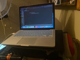 Macbook pro A1502 like new still has plastic on screen few scrathes bottom""