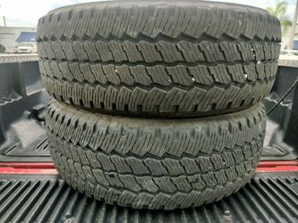 A SET OF 2 USED TIRES LT275/65/20