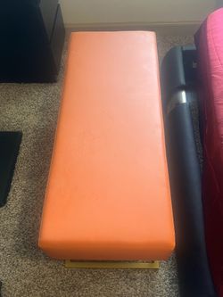 Orange leather bench in perfect condition