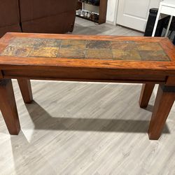 Heavy wood table with decorative tile top