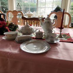 Is beautiful Blue Hill China 9 is a 9 place setting complete with serving platter.