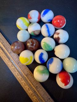 18 vintage shooter marbles in antique ball jar