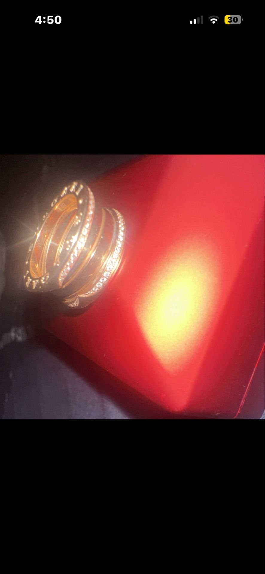 Rose Gold Ring from bvlgari with diamonds around it
