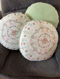 3 throw pillows floral front light green back. Almost new