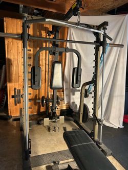 Nautilus Smith Machine with Chest fly, upper and lower pulleys, bench, attachments, and weights