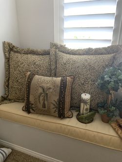 Tommy bahama theme pillows, frames, candle and topiary trees