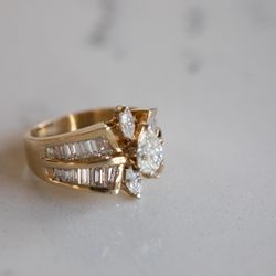 Vintage 14kt gold ring featuring marquise and baguette diamonds, size 7
