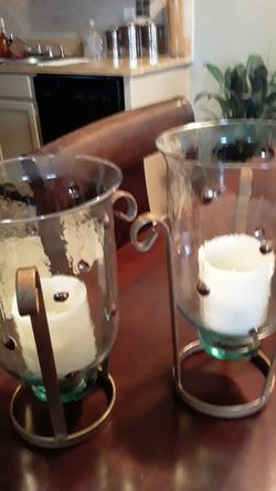 To glass and iron candle holders
