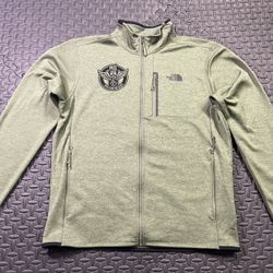 Green and black The North Face 