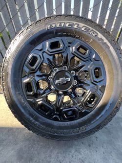 CHEVROLET STOCK WHEELS AND BRIDGESTONE TIRES